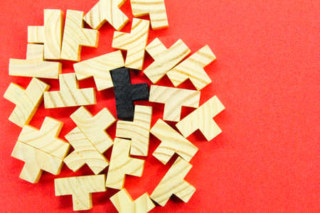 flat wooden Puzzles strewn with one black. unique concept
