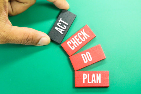 colored board with the letters PDCA (Plan do check act). Business goals and strategy concept