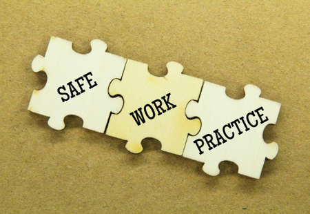 Wooden puzzles with the word safe work practiceの写真素材