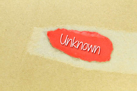 red paper with unknown words. unknown or unrecognizedの写真素材