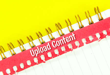 red paper torn with the word content uploadの写真素材