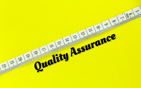 measuring strap with the word quality assurance. the concept of quality assuranceの写真素材