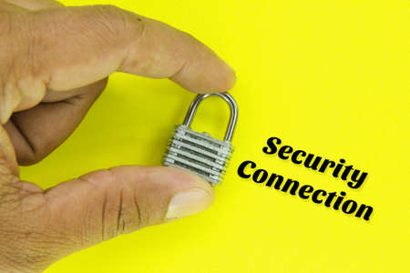 the finger holds the key with the word security connectionの写真素材