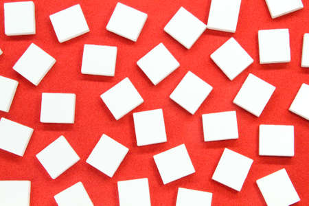 red white squares strewn with red background. scattered compartments