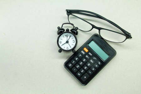 calculator, glasses and alarm clock. computational conceptの写真素材