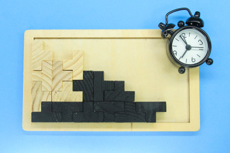 alarm clocks and wooden puzzles with constructive concepts