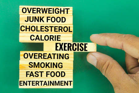 wooden boards with unhealthy lifestyle practices and an exercise. health practices