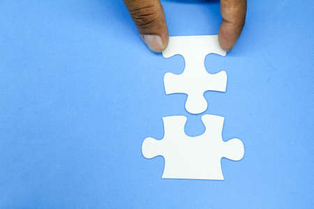 two white Puzzles with the concept of group work