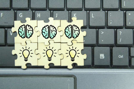 puzzle with bulb and brain icons. a combination of ideas and brains