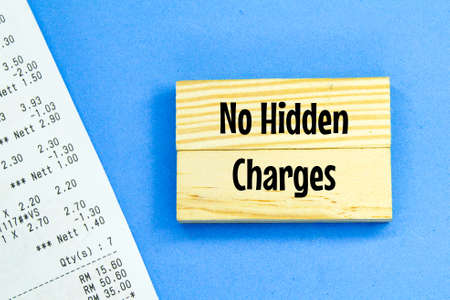 receipts and wooden boards with the words No Hidden Charges