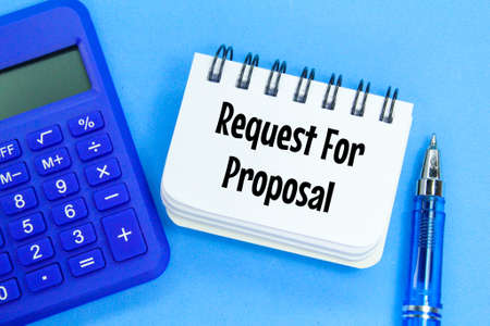 calculator, pen and notebook with the words request for proposalの写真素材