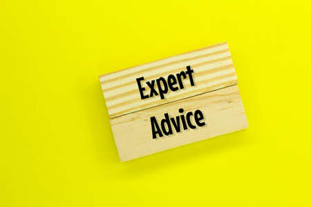 wooden board with the words Expert Adviceの写真素材