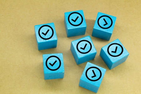 a blue cube with a right sign or a right sign. the concept of the right signの写真素材