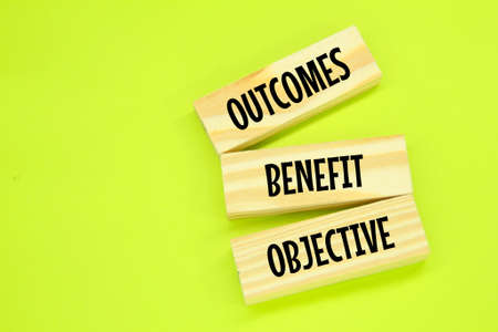 wooden board with the words Objective Benefit Outcomesの写真素材