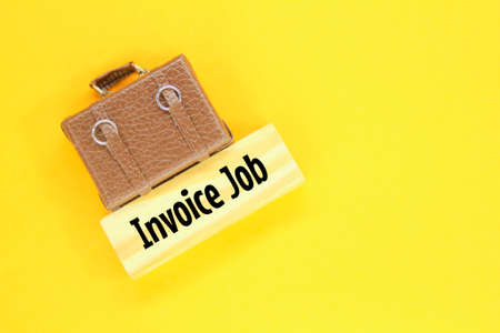 work bag model and wooden board with the word Job Invoice