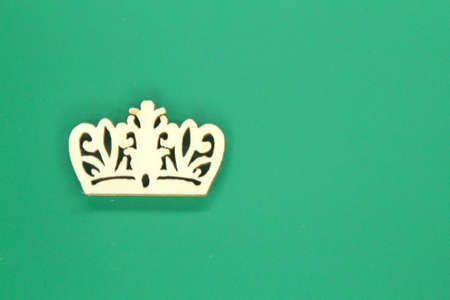 wooden crown with green background. the concept of a kingの写真素材