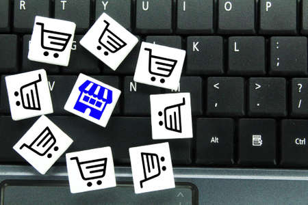 laptop keyboards and shopping and cart icons. the concept of buying online