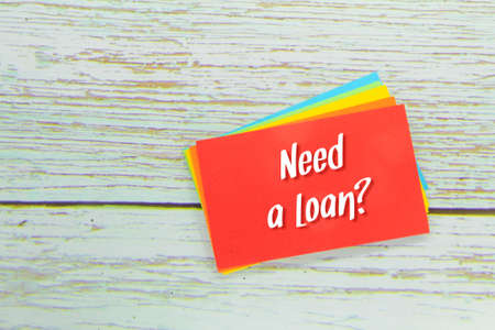 colored paper with the words need a loan