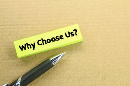colored pens and paper with the question why choose us?の写真素材