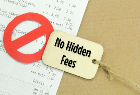 receipts, prohibited marks and wooden tags with the words no hidden feesの写真素材