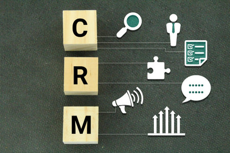 wooden cubes with the letters CRM or the word Customer Relationship Management. CRM conceptの写真素材