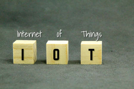 wooden cubes with the letters IoT or the word Internet Of Thingsの写真素材