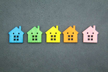 Colored houses are arranged by color. the concept of the choice of colored housesの写真素材