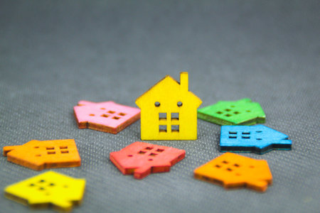 a model of a colored wooden house with the concept of a housing crisisの写真素材