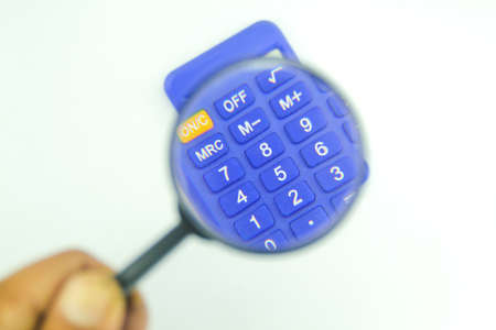 zoom magnifying glass on the calculator number. the concept of countingの写真素材