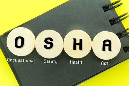round wood with the letters OSHA or the words Occupational Safety and Health Actの写真素材