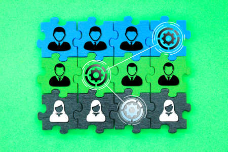 Puzzles with icons of a group of team workers. the concept of group relationships. HR management