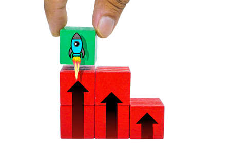 colored cubes with up arrows and flying rockets. the concept of increasing upの写真素材