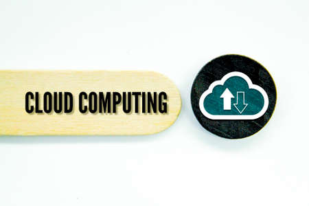 wooden and round black board with icons and words cloud computingの写真素材