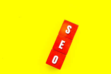 red squares with the letters SEO or the word search engine optimizationの写真素材