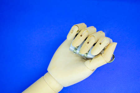 wooden hand holding lock code. the concept of security in your hands