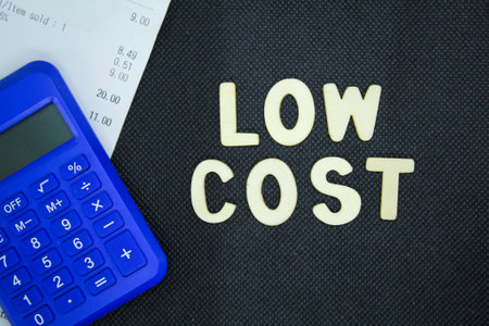calculator and receipt with the word low cost. Business and economy concept.の写真素材