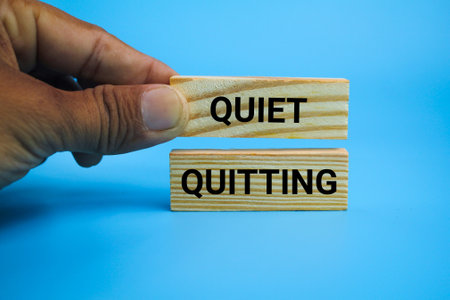 wooden board with the word Quiet quitting. Quiet quitting business conceptの写真素材