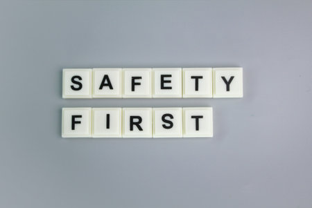 letters of the alphabet with the word safety first. the concept of prioritizing safety in a matter or industryの写真素材