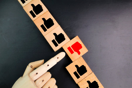 wooden square with finger up and down icons. good and not so good Concept. concept reviewed. user...