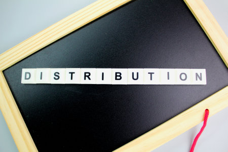 letters of the alphabet with word distribution. distribution concept. the action of sharing something out among a number of recipients.の写真素材