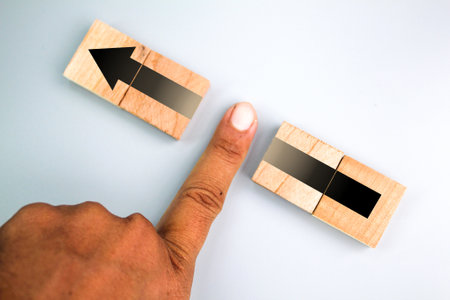 The finger divides the arrow into two parts or blocks the arrow. Disruption, slowing down the...
