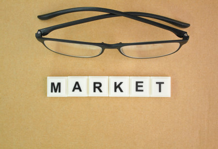glasses with the alphabet word MARKET. the concept of a market or looking for a market.の写真素材