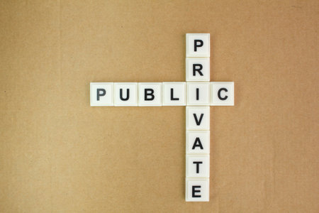 letters of the alphabet with the words private and public. Concept crossword clues. Business and private or public conceptの写真素材