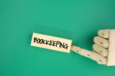 finger pushing stick with the word bookkeeping. bookkeeping concept