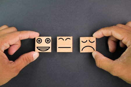 fingers choose a happy face and a sad face. hire good or potential or non-toxic employees. Customer service ratings and service ratings satisfaction surveysの写真素材