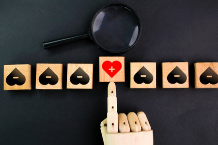 hand fan magnifier select the health icon in the row of unhealthy icons. the concept of choosing...