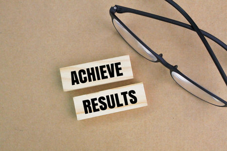 glasses with the word achieve results. the concept of achieving results or goals. business successの写真素材