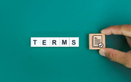 hand holding stick with icon and word terms. the concept of terms or conditions. read the terms.の写真素材