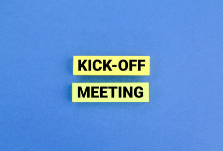 colored paper with the word meeting kick-off. Kick-off meeting concept.の写真素材