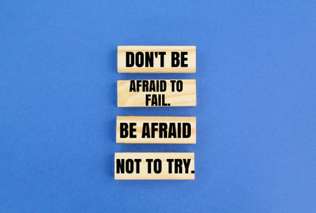 arrange sticks with the words don't be afraid to fail. be afraid not to try